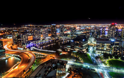 High angle view of illuminated city buildings at night