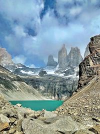 Scenic view of mountains against cloudy sky