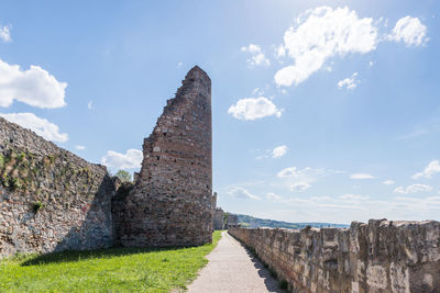 Panoramic view of stone wall against sky