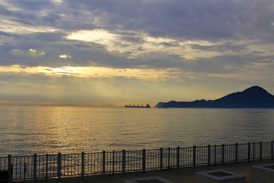 Scenic view of sea against cloudy sky