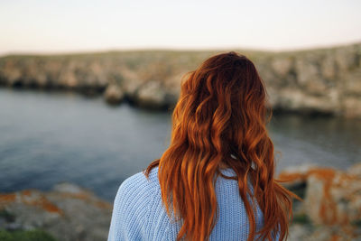 Rear view of woman looking at sea