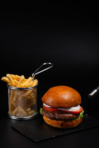 Close-up of food on table against black background