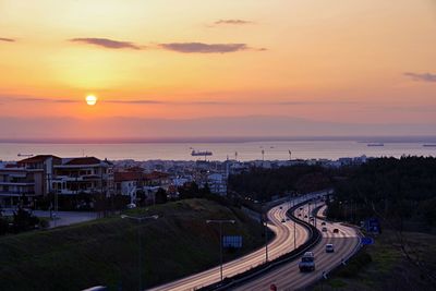 High angle view of city at sunset