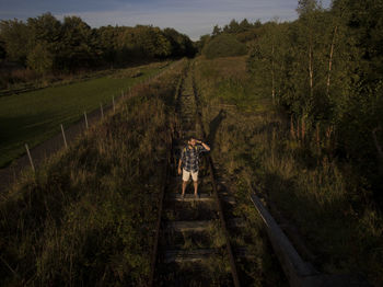 Rear view of man on field