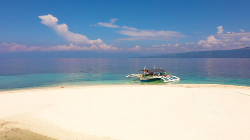 Perfect beach with blue water and white sand.   digyo island, philippines. 
