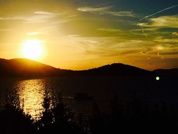 Scenic view of mountains against sky during sunset