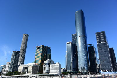 Low angle view of modern buildings against clear sky