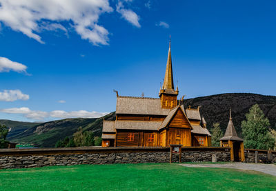 Temple building against cloudy sky