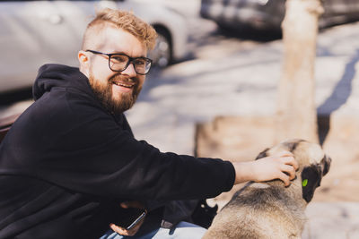 Side view of man with dog