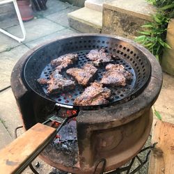 High angle view of meat on barbecue grill