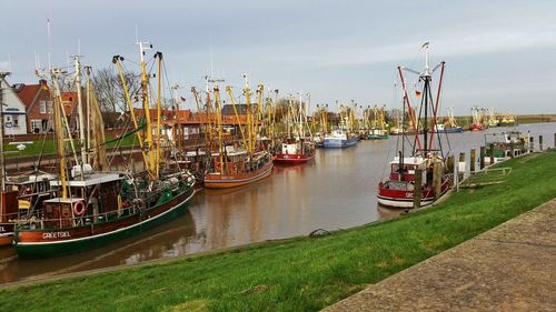 Boats moored at harbor