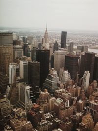 High angle view of city buildings against sky