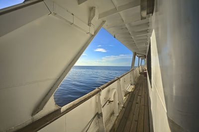 Scenic view of sea against sky seen through window