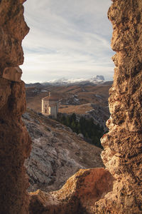 Rock formations on landscape against sky