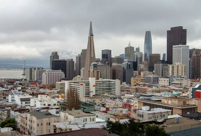 Modern buildings in city against sky