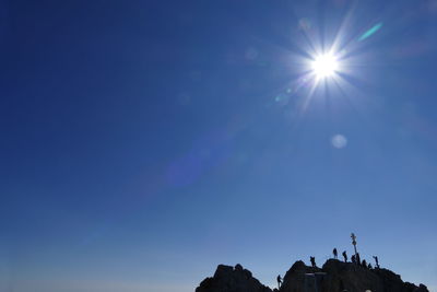 Low angle view of blue sky on sunny day