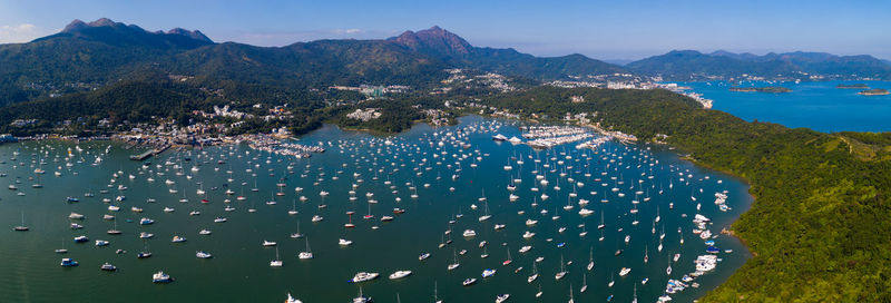 High angle view of sea and cityscape against sky