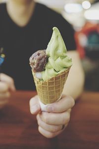 Cropped image of person holding ice cream