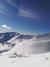 Scenic view of mountains against sky during winter