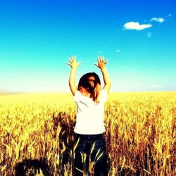 Woman standing on grassy field