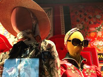 Mannequin with arms raised