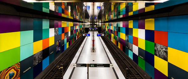 Train at illuminated railroad station