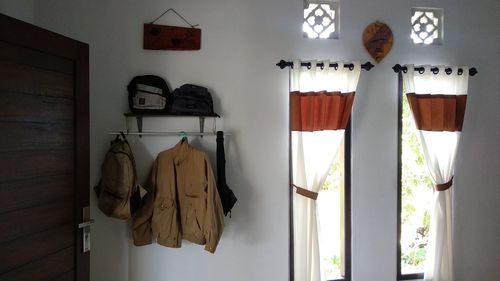 Clothes hanging on wall at home