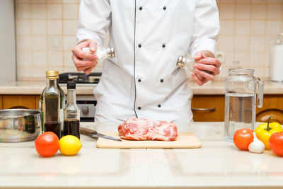 Man preparing food on cutting board