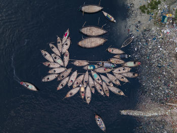 Aerial view of wooden passenger boats along the buriganga river, keraniganj, dhaka, bangladesh