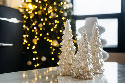 Close-up of illuminated christmas tree on table