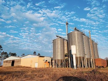 Panoramic shot of agricultural field against sky