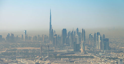 View of modern buildings in city against sky