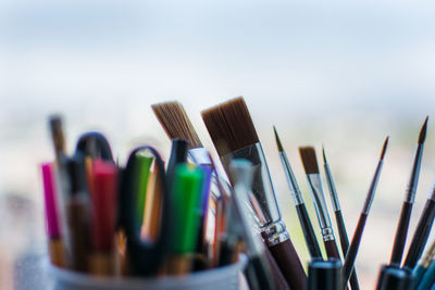 Close-up of paintbrushes on table