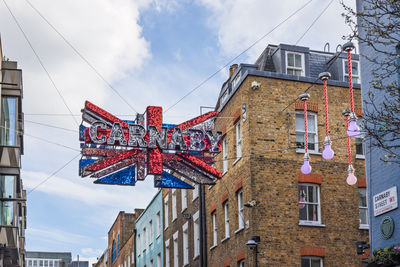 Vibrant carnaby street in london decorated with union jack flag. london, uk, 3 march 2024