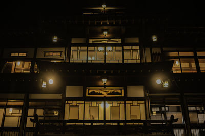 Low angle view of illuminated ceiling at night