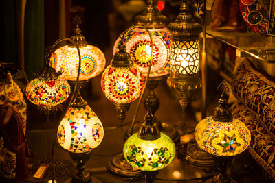 Low angle view of illuminated lanterns in store