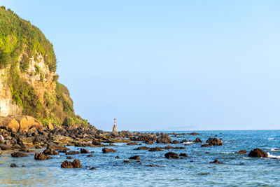 Volcanic rocks and reefs on the coast