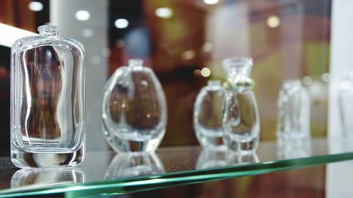 Close-up of glass bottles on table in restaurant