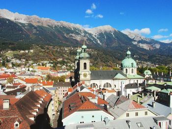 Buildings in town against sky