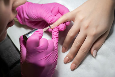Close-up of woman holding hands