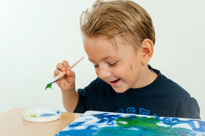 Portrait of boy looking at table