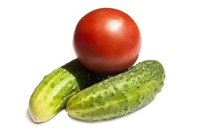 Close-up of fruits over white background