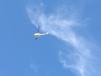 Low angle view of airplane flying in sky