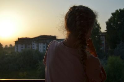 Rear view of teenage girl with braided hair