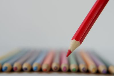 Close-up of colored pencils against white background