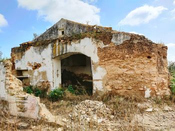 Low angle view of old building against sky