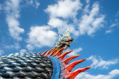 Low angle view of statue against blue sky