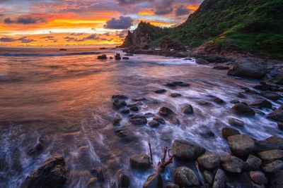 Scenic view of sea against sky at sunset