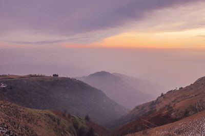 Scenic view of mountains against sky during sunset