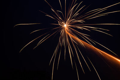 Low angle view of firework exploding against clear sky
